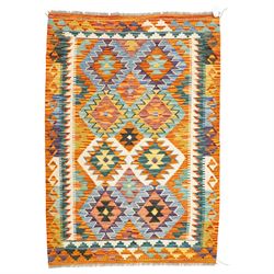 Afghan Chobi kilim flatweave runner with a repeating stepped diamond medallion design in l...