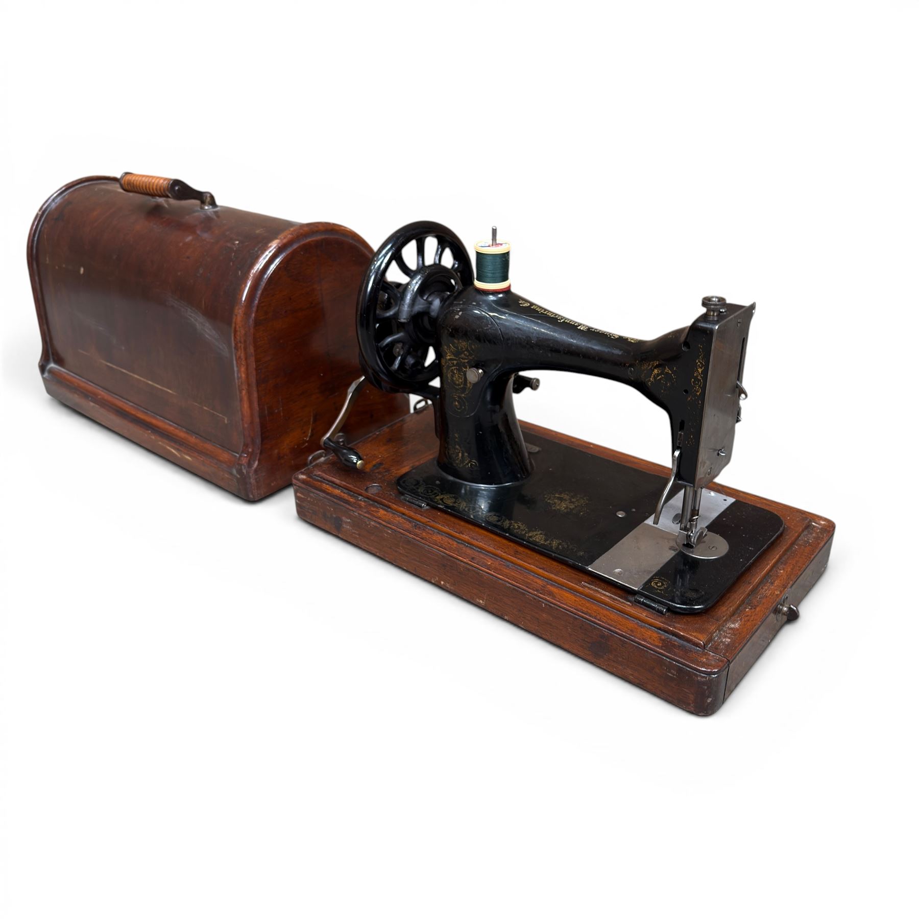Three Singer wooden cased sewing machines 