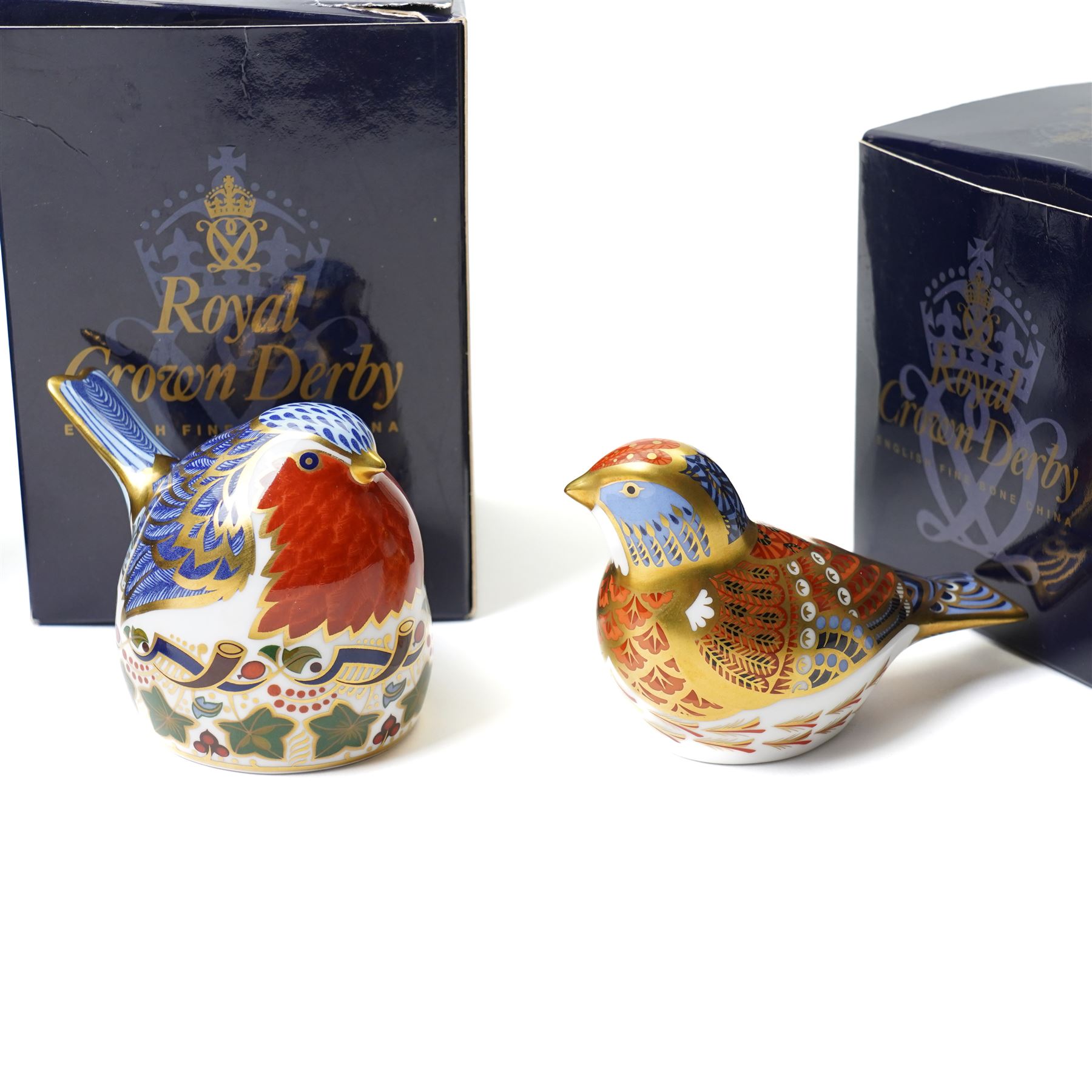 Six Royal Crown Derby paperweights, comprising Robin (unboxed), Robin nesting with gold stopper, Goldfinch nesting with gold stopper, Linnet with gold stopper, Tawny Owl with gold stopper and Crested Tit with gold stopper (6)