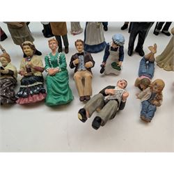 1:12 scale dolls house composite figures, including policeman, postman, maid, sitting and standing people in various styles of dress, etc