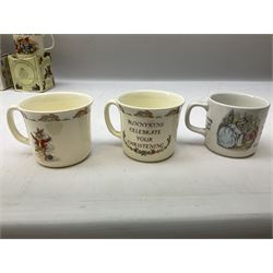 Royal Doulton Bunnykins nursery set in box and two cups, together with two Wedgwood Peter Rabbit mugs and Royal Staffordshire Noddy money box and cup (7)
