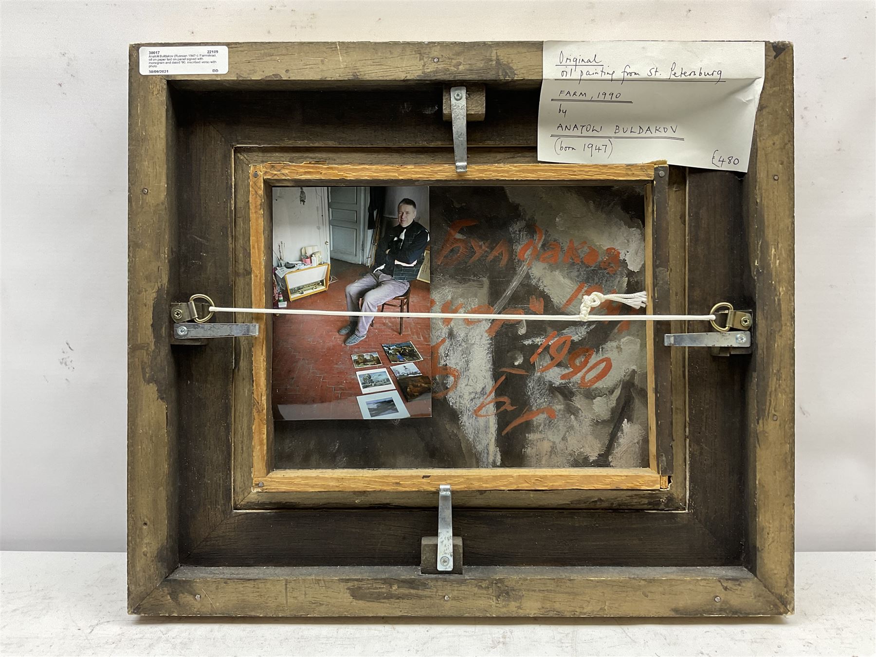 Anatoli Buldakov (Russian 1947-): Farmstead, oil on paper laid on panel signed with monogram and dated '90, inscribed verso with photo of the artist 19cm x 25cm