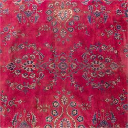 Large Persian-style mahal-type hand-knotted carpet, of rectangular form with a deep crimson field decorated with an all-over arrangement of stylized floral sprays and palmettes, with a central subtle medallion composition enclosed by a dark navy main border of scrolling floral motifs between narrow guard stripes with fringe ends 