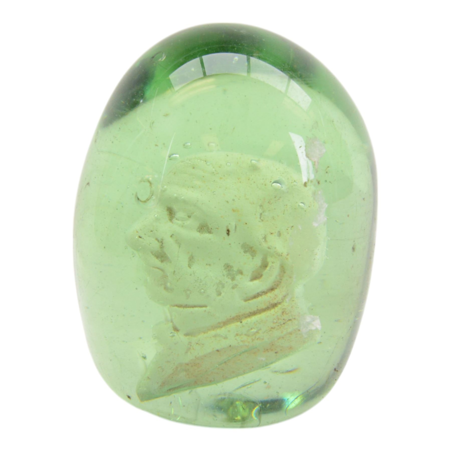 Three Victorian green glass dumps, two internally decorated with a bust profile of William Ewart Gladstone and one with a medallion to the centre, tallest H10cm