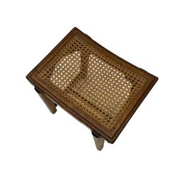 Early 20th century mahogany 'saddle' stool, removable cane seat