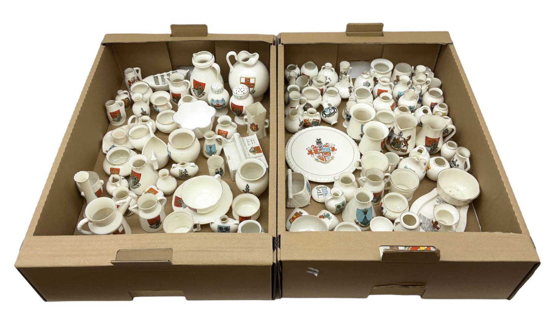 Collection of W H Goss crested ware, to include Yorkshire Roman Ewer, Scarborough ancient jug, salt and pepper shakers, Norwegian horse shaped beer bowl, The Old Horse Shoe, etc, together with five Shelley examples modelled as piano, boat, heart shaped box, etc, in two boxes 