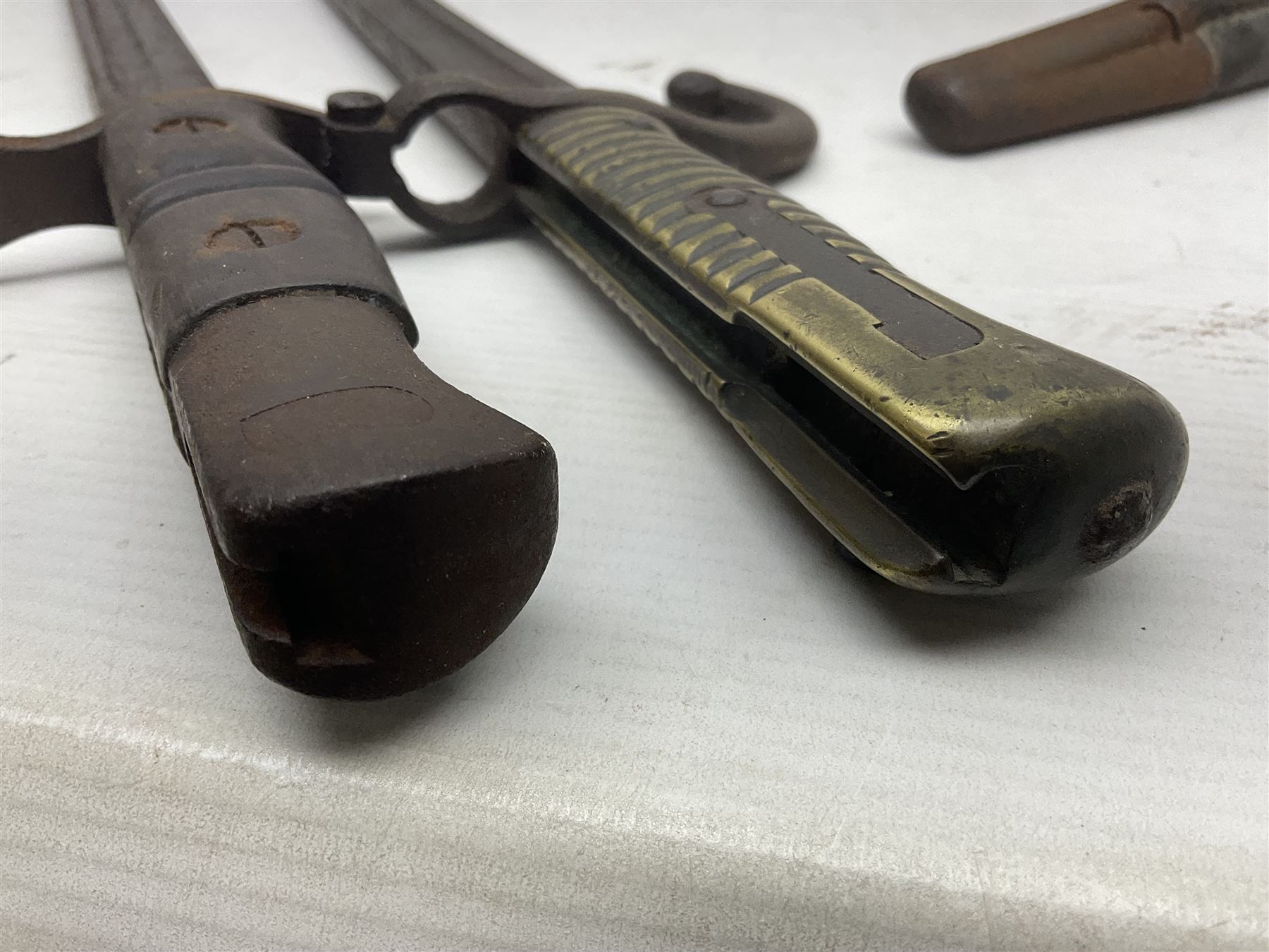 WWI Remington Pattern 1913 bayonet, the 43cm fullered blade with various marks to the ricasso including date code 11 16; in leather covered scabbard with various stamps including JWB 17 L58cm overall; and a French Model 1866 sabre bayonet (no scabbard)