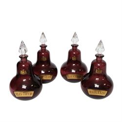 Set of four 20th century Royal Pharmaceutical Society amethyst glass bottles, of bellied form with clear cut glass spire stopper, each body bearing gilt label in Latin: ELIX:THYM:, ELIX:CAMPH:, ELIX:ANIS: and ELIX:SENN:, and gilt Royal Pharmaceutical Society crest to neck, H25cm

Provenance: From the collection of the family of Peter Green, a practising pharmacist whose career spanned the mid to late 20th century. During his professional life he managed pharmacies in Yeovil, Somerset, and later Selles Chemist in Filey, North Yorkshire, before purchasing and running his own business, Peter Green Pharmacy, located in the Market Place, Malton. The bottles were displayed as part of the traditional shop fittings in both the Filey and Malton pharmacies and were retained as part of his collection.
