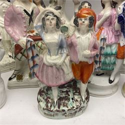 Collection of 19th century and later Staffordshire figures, including figure of a spill vases, figure groups and houses, tallest H28cm (11)