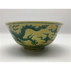 Pair of Chinese famille jaune bowls, decorated in green enamel with a dragon chasing a flaming pearl amongst clouds, upon a yellow ground, the interior decorated to centre with dragon, with six character mark beneath, D17.5cm