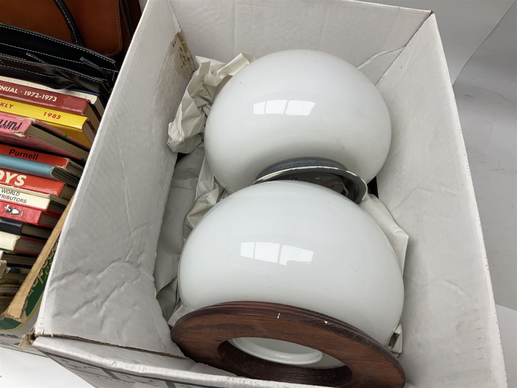 Collection of silver plated cased cutlery including part canteens and butter knives, together with other metal ware including J&J Siddons iron, horse brasses and a copper kettle, 1970s children's annuals including Beano, two handbags and three suitcases, vintage tins etc, in four boxes 