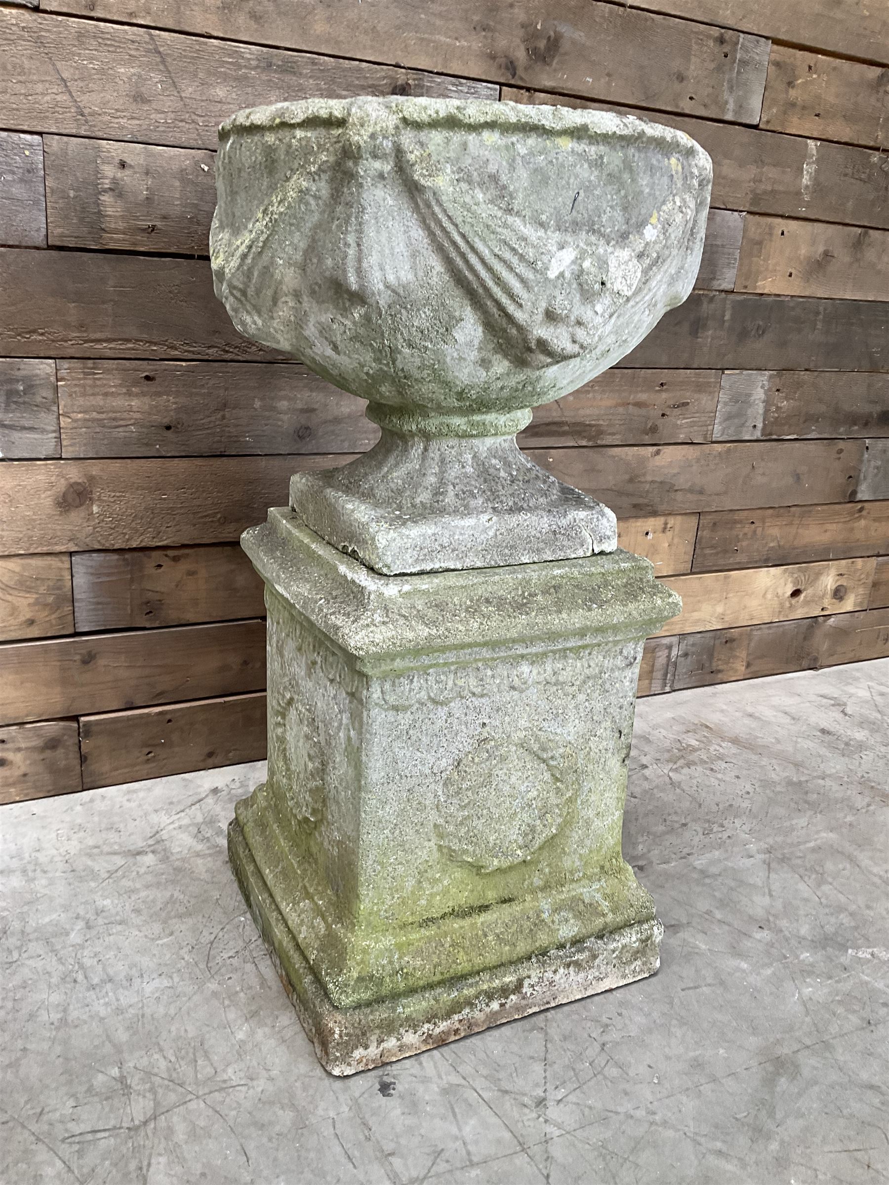 Cast stone centerpiece urn on plinth