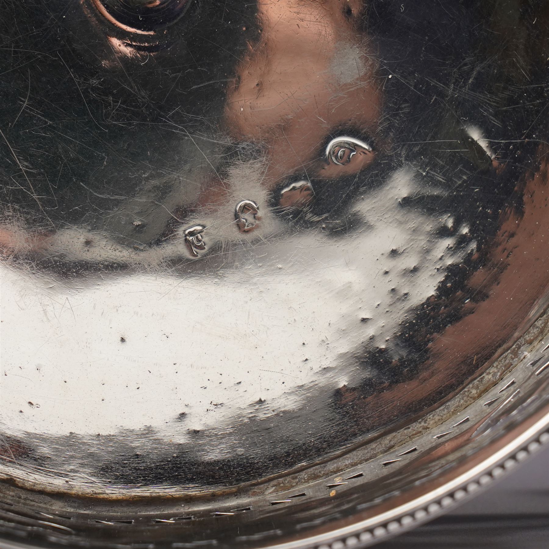 George III silver circular stand, originally a cruet stand, with pieced rim decorated with garlands and swags with turned wood base on claw and ball feet D14cm