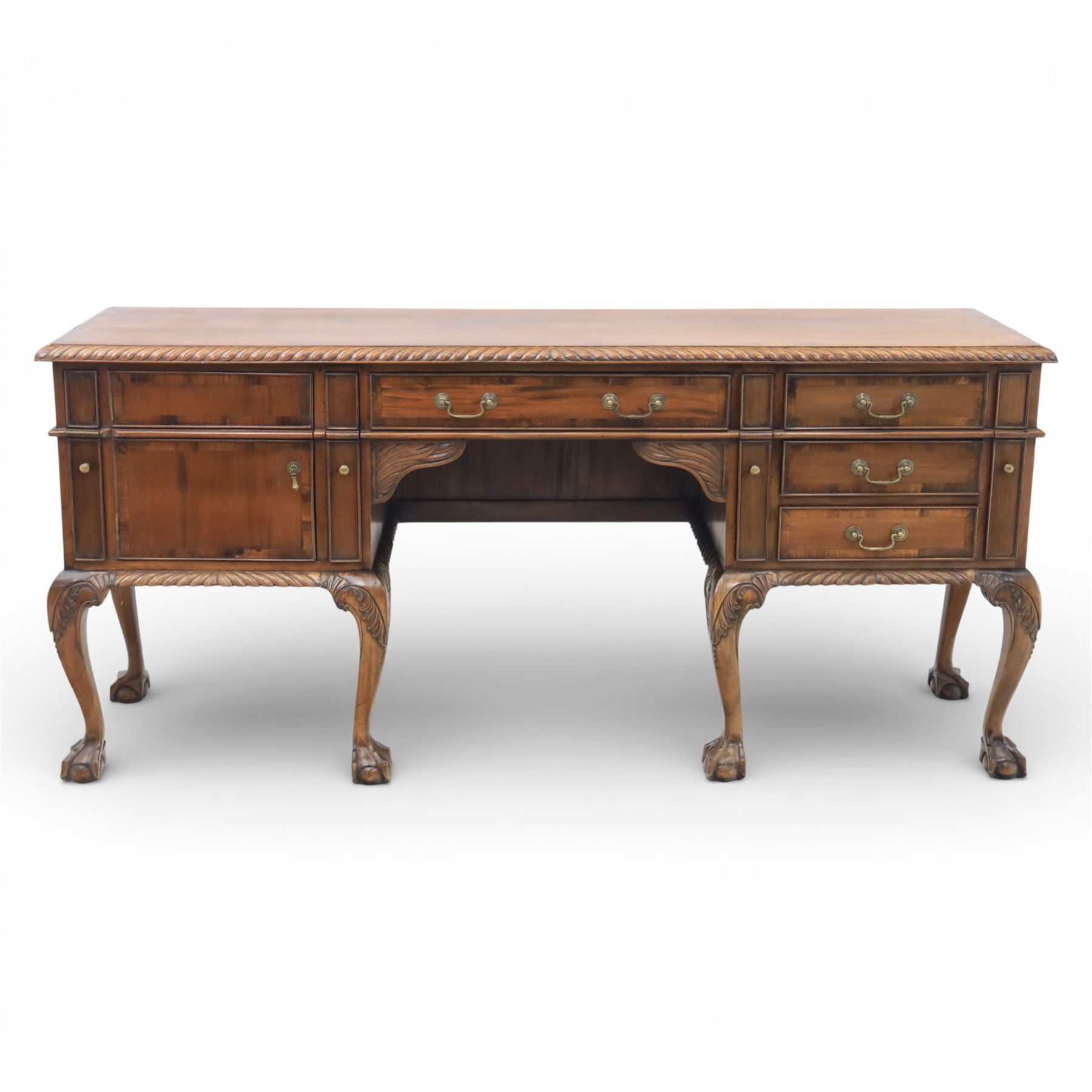 Georgian design mahogany sideboard, the rectangular top with moulded gadrooned edge, fitted with a central frieze drawer flanked by cupboard doors, raised upon cabriole legs terminating in ball and claw feet