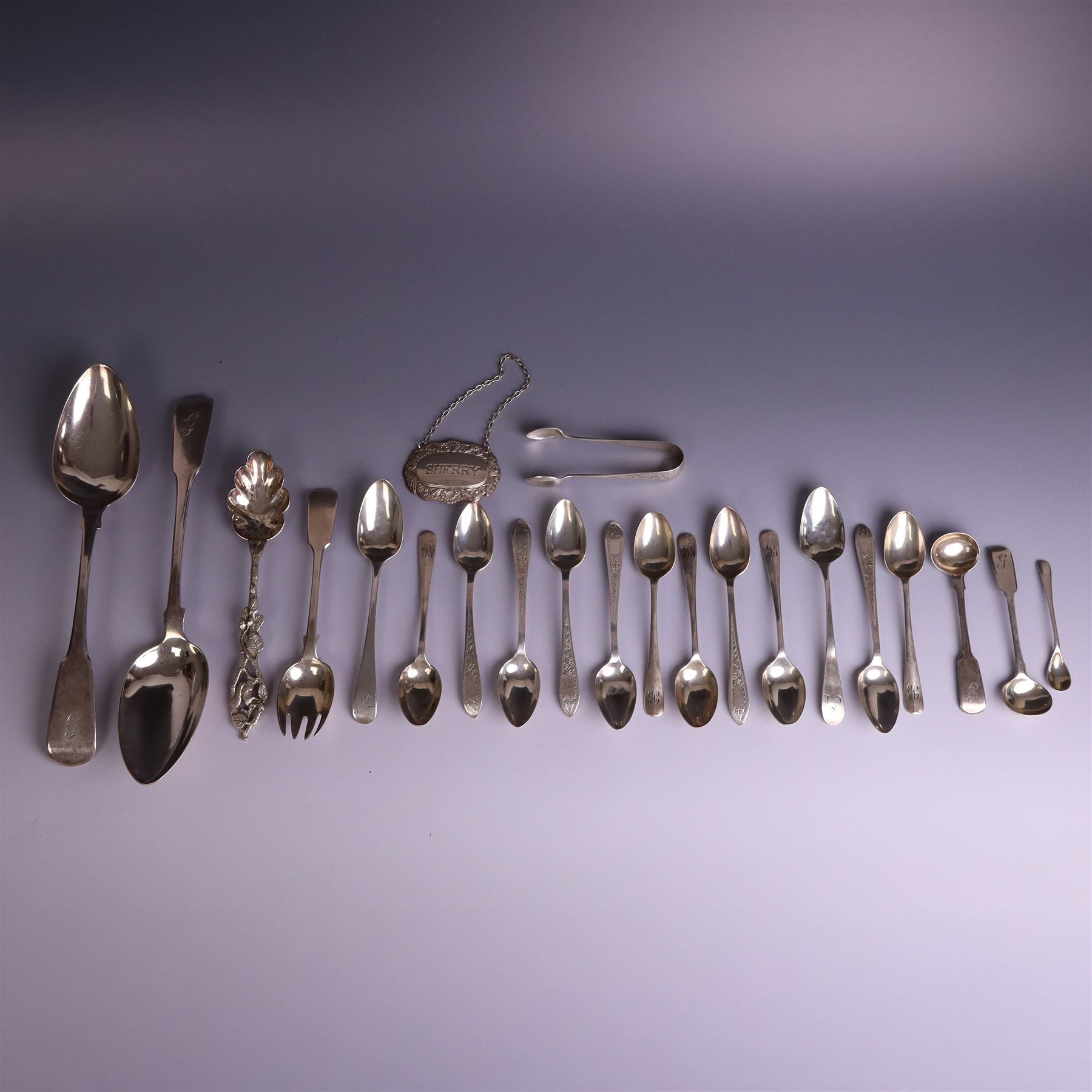 Collection of silver flatware, including pair of George III Fiddle patter table spoons and set of six Edwardian teaspoons with ivy decoration and matching sugar tongs, together with a silver 'Sherry' decanter label