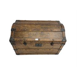 Late 19th to early 20th century oak framed travelling trunk, dome top with iron fittings and panelled sides and top, interior labelled 'The Anchor Patent Waterproof Travelling Trunk - 1902'