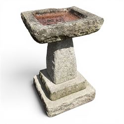 Early 20th century composite three-piece stone birdbath, square dished top on tapering ped...