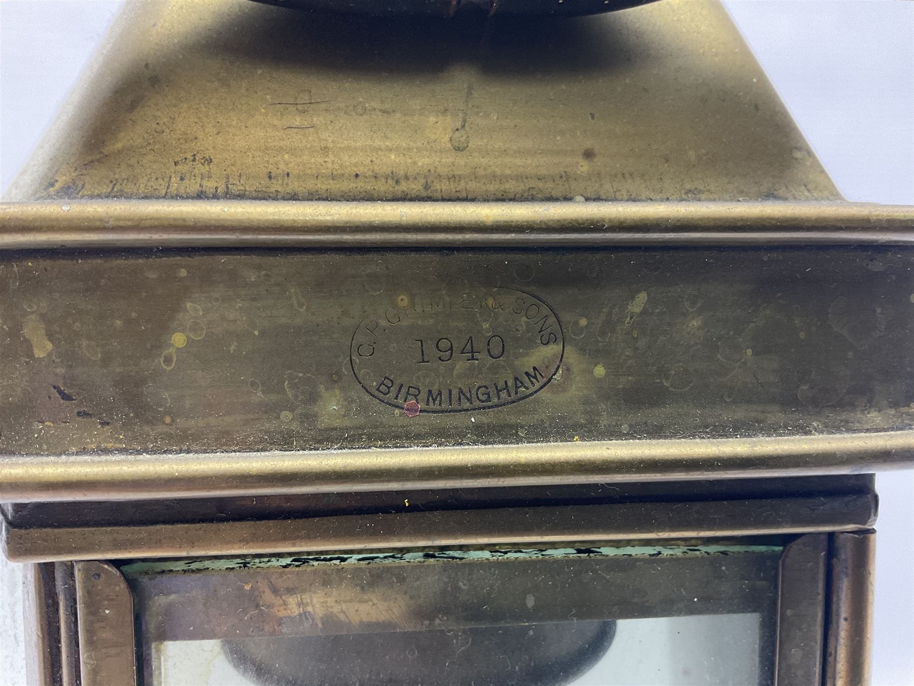 Large brass maritime lamp by Griffiths & Sons Birmingham with swing handle, threaded mounting bracket and associated oil burner, H41cm excluding handle