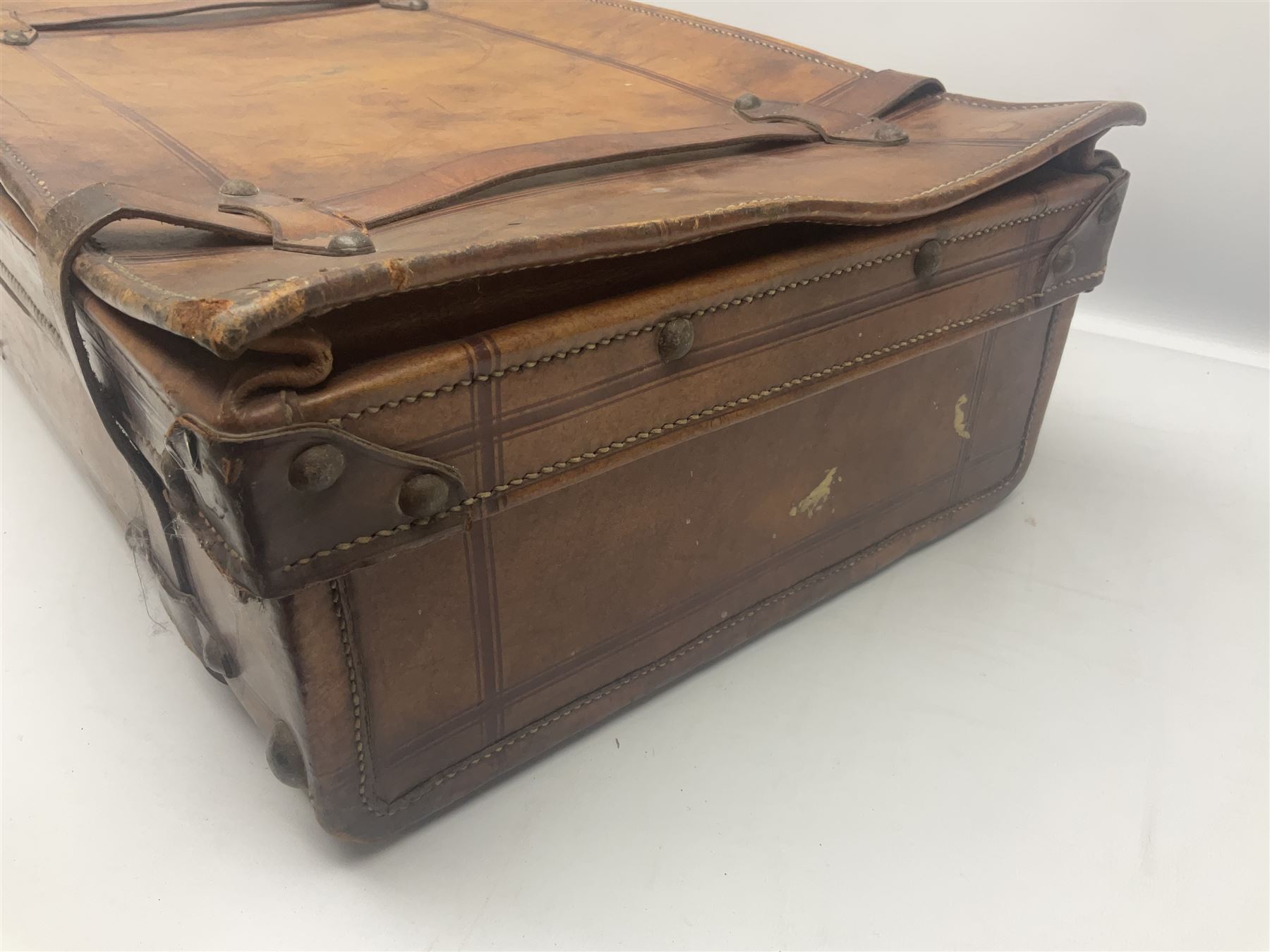 Late 19th/early 20th century stitched and studded leather portmanteau type suitcase with expanding lid and straps, L61cm