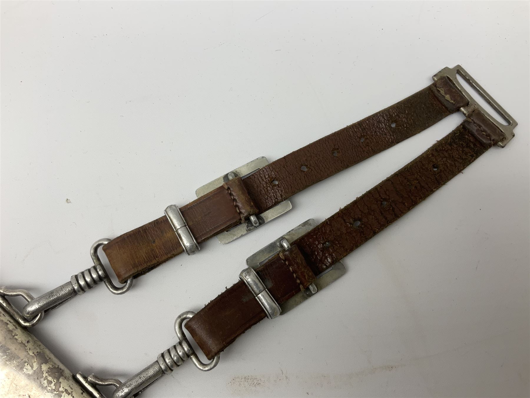 German Reichsarbeitdienst RAD Leader's Hewer dagger, the 26cm single edged scimitar shaped blade with narrow fuller, etched Arbeit adelt; by E.D. Wusthof, Solingen; the aluminium hilt with spade and wheat ear langet; two piece white plastic grip and eagle head pommel; pebbled steel scabbard engraved with ears of wheat and strapwork with double leather hangers L40cm overall