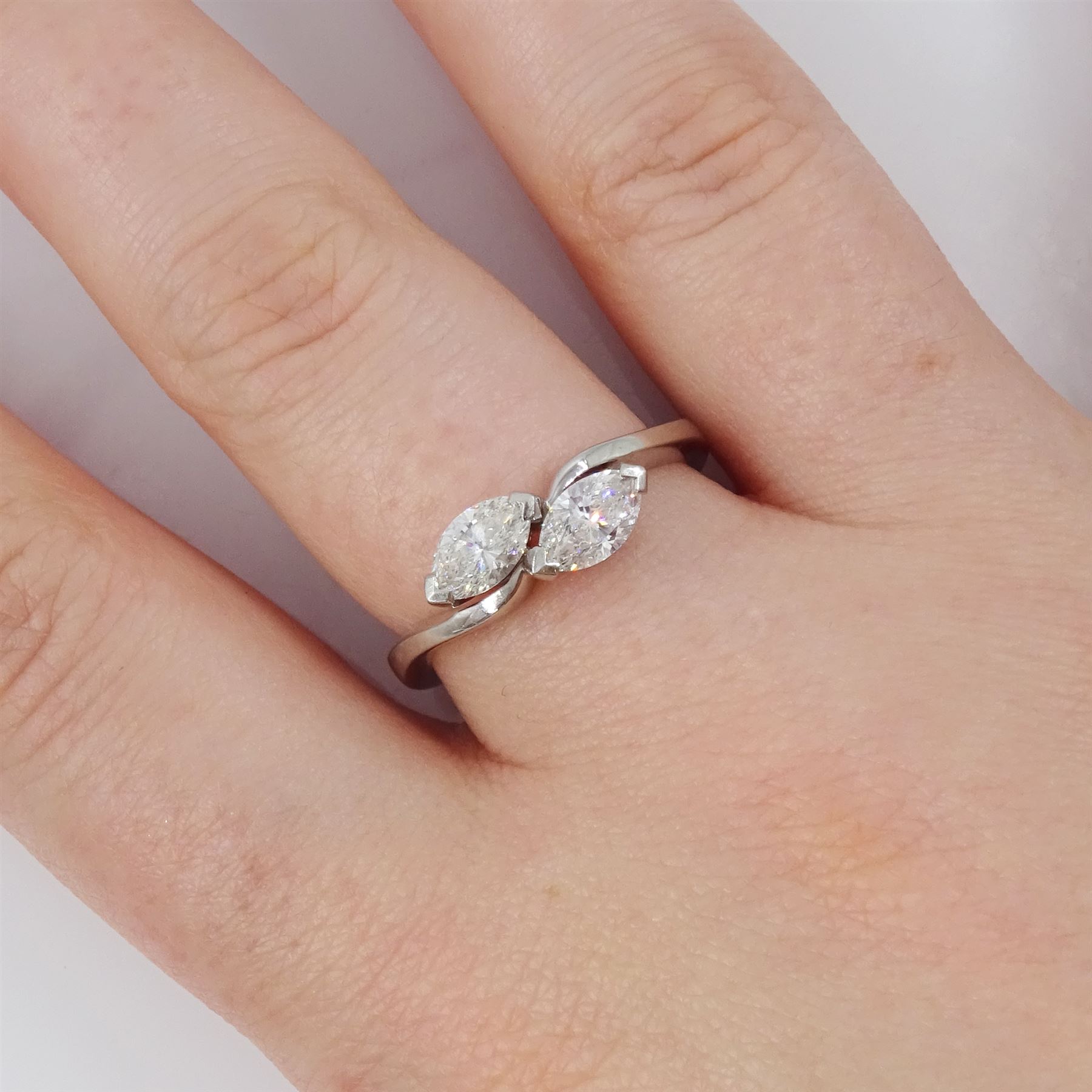 Platinum diamond crossover ring, set with two marquise cut diamonds, London 2010, total diamond weight approx 0.80 carat