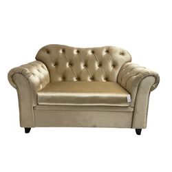 Chesterfield shaped snuggler sofa, upholstered in buttoned champagne fabric, with scatter cushions