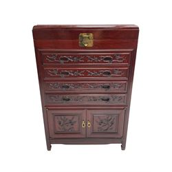 Chinese hardwood canteen cutlery cabinet, fitted with four drawers over double cupboard, the facias decorated with moulded foliage  