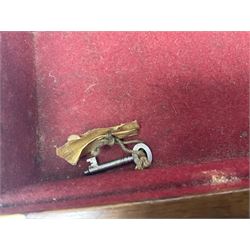 Leather shotgun case, the red baize lined interior with the trade labels of Westley Richards & Co., London, a brass plaque inscribed 'T Nevin, Mirfield, Yorkshire' to cover, with key, case to fit barrel 76cm (30 inches)  
