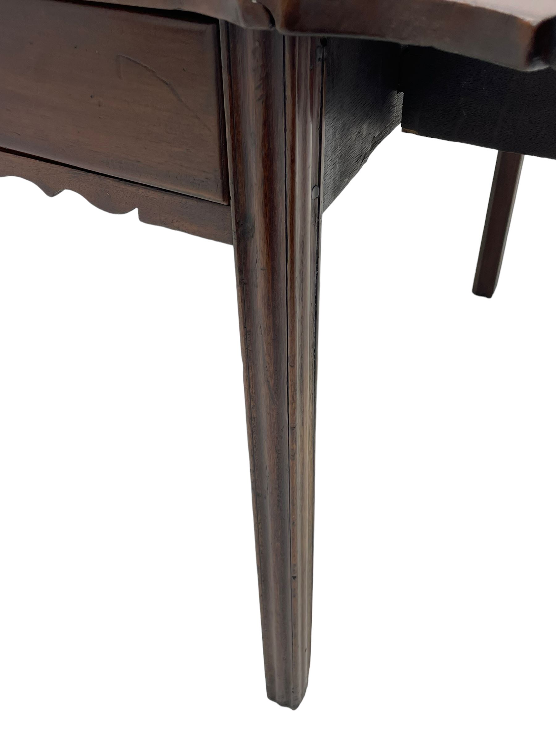 George III mahogany serpentine Pembroke table, the shaped drop-leaf top over single end drawer and shaped end rails, on square moulded supports