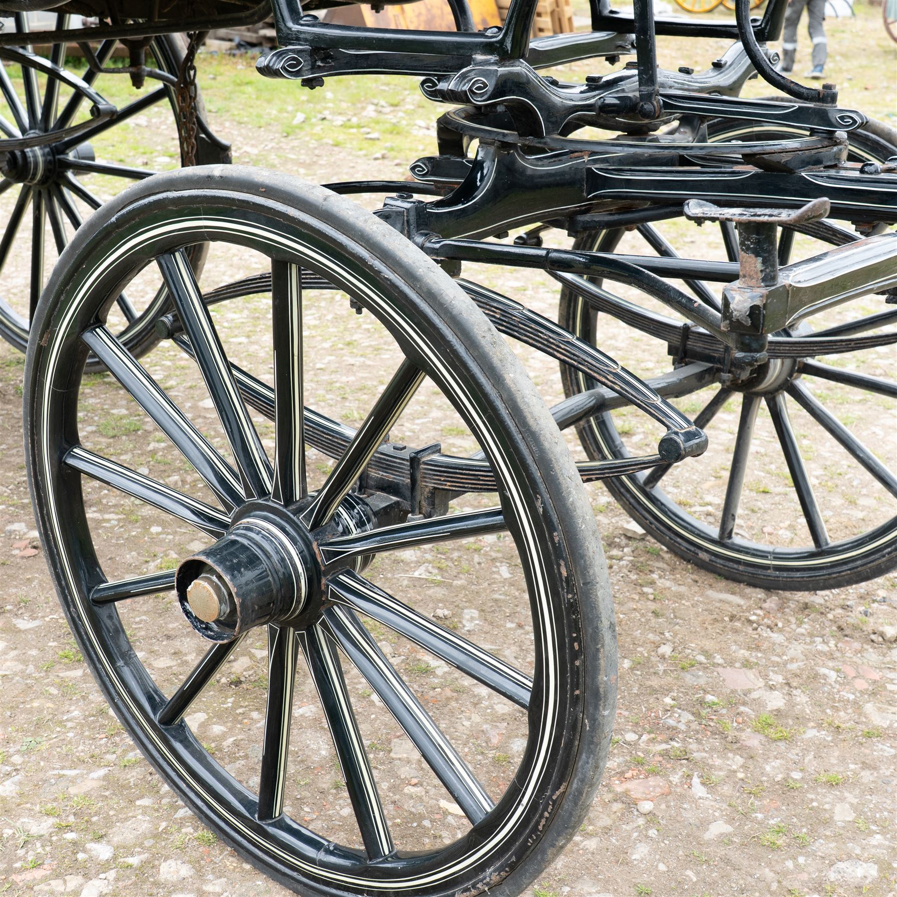 Victorian Glass Hearse

A black painted four wheeled horse drawn glass hearse with extensively glazed coffin compartment, etched glass side and end panels, decorative gilt cresting, gilt column capitals, white painted interior bier deck, metal coffin rails with cross finials, rear glazed access doors, external coachman's box seat for two, wooden spoked wheels the wheel hubs stamped 'The Economic Funeral Co', leaf spring suspension, underbody turntable steering and pole for driving with a pair of horses. The hearse has decorative painted lining throughout and an ornate black and gilt body with curved glass panels to the sides and rear.

Features

• Extensively glazed coffin compartment
• Etched glass side and end panels
• Decorative gilt cresting
• Gilt column capitals
• White painted interior bier deck
• Metal coffin rails with cross finials
• Rear glazed access doors
• External coachman's box seat
• Wooden spoked wheels
• Leaf spring suspension
• Underbody turntable steering
• Pole for driving with a pair of horses
• Decorative painted lining

Dimensions:
Overall length: 406 cm
Body length: 250 cm
Overall width: 190 cm
Body width: 115 cm
Height: 228 cm

Wheel Diameters:
Front wheels: 102 cm
Rear wheels: 133 cm

Seating

Coachman's box seat: 2