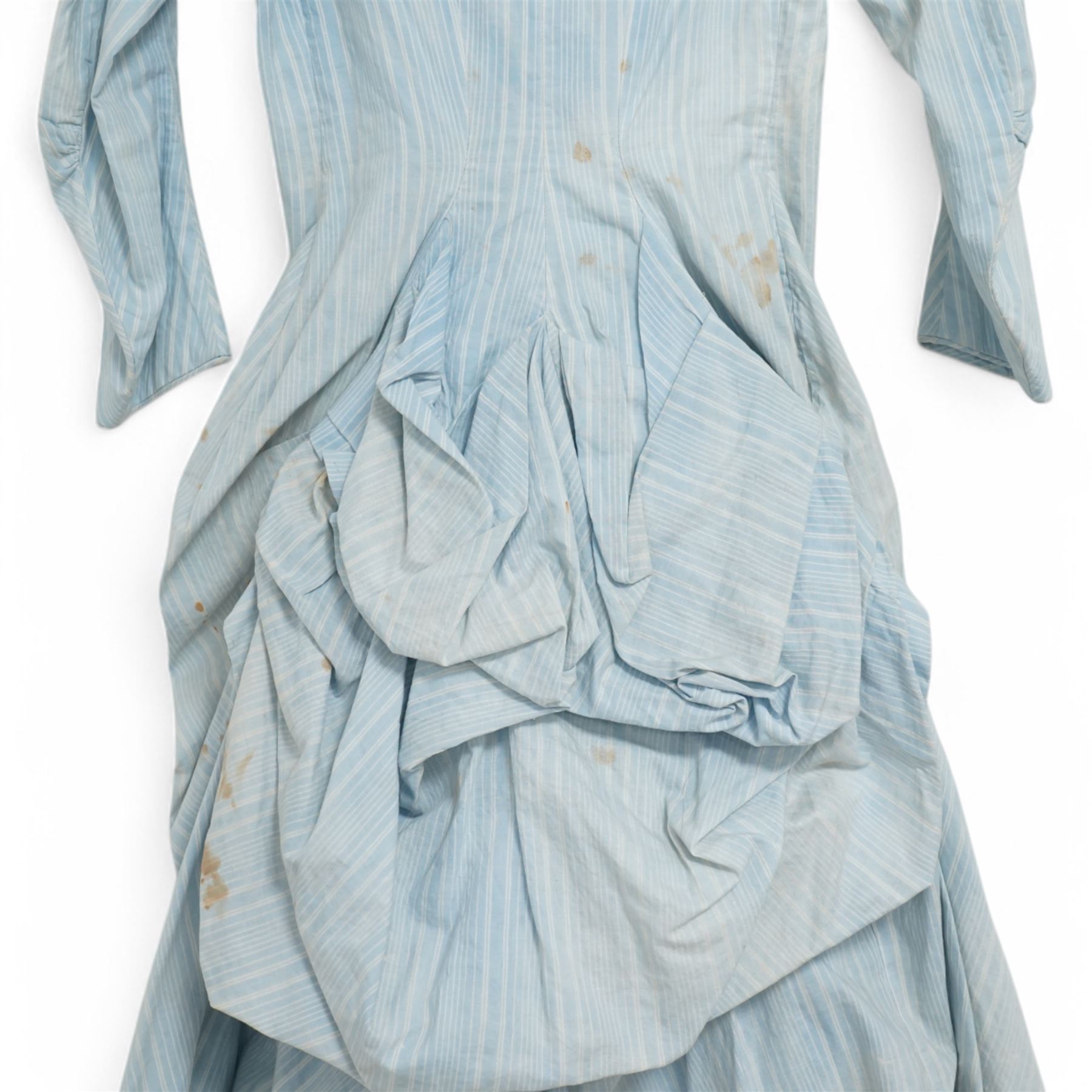 Victorian ladies button-down bodice and skirt, in blue and white striped fabric with pleated detailing, the skirt with gathered bustle back