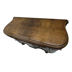 Late 20th century Italian walnut sideboard, serpentine front and bow-shaped top with highly figured veneer, single checkered-pattern frieze drawer over two drawers with central foliage cartouche, flanked by hinged frieze drawers over cupboards, on turned and carved supports