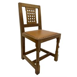 Rabbitman - set of six (4+2) oak dining chairs, carved and pierced lattice back, tan leather upholstered seat with stud band, on octagonal supports united by H-stretchers, carved with rabbit signature, by Peter Heap, Wetwang 