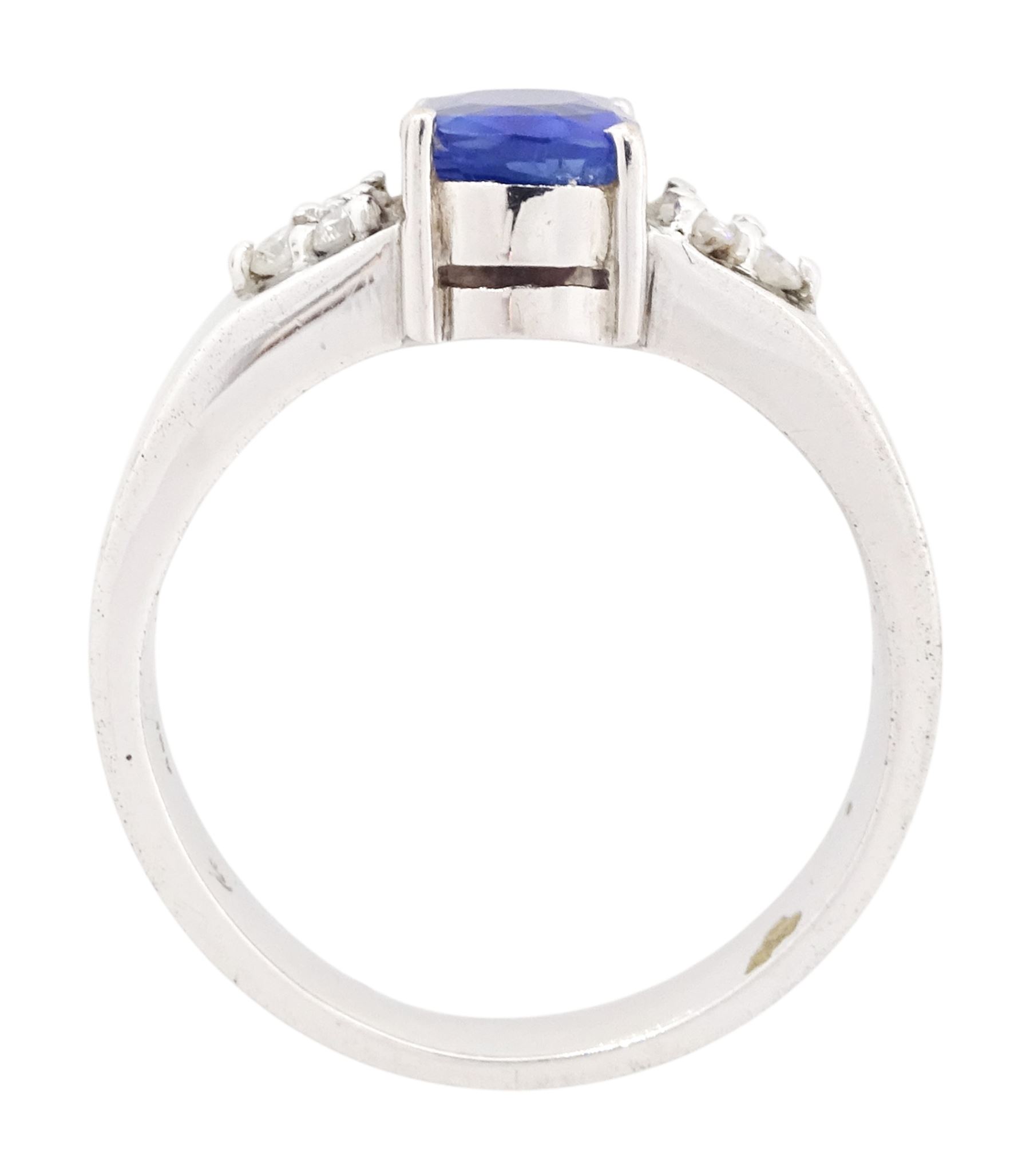 18ct white gold sapphire and diamond ring, cushion cut sapphire of approx 1.00 carat, with three round brilliant cut diamonds set either side, total diamond weight approx 0.10 carat