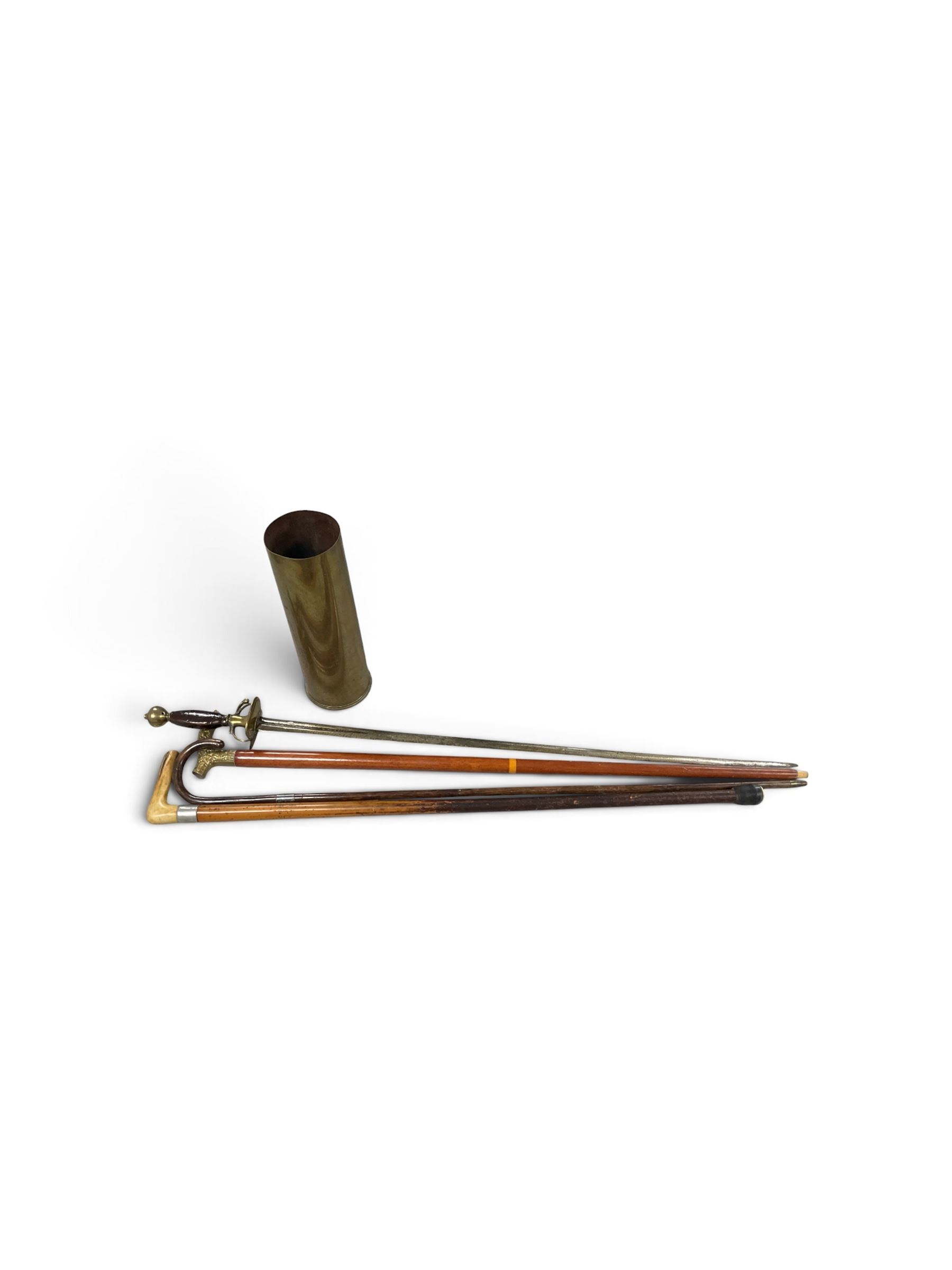 Sword, three walking sticks and shell case
