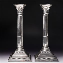 Pair of silver Corinthian column candlesticks with stepped square bases H30cm Birmingham 1...