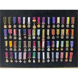 Two limited edition large framed display boards with half-size copies of British Gallantry and Campaign Medals produced by Danbury Mint and entitled 'For Valour'. Sixty medals on each board, all with ribbons. Complete with Danbury Mint certificate serial number A0148 and other paperwork.