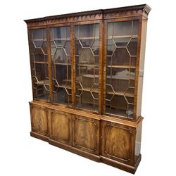 Bevan Funnell - Georgian design mahogany breakfront bookcase, moulded dentil and arcaded frieze over four astragal glazed doors, four cupboards below enclosed by figured doors, on skirted base