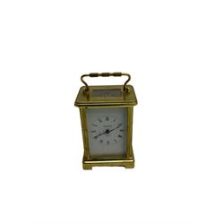  20th century French cornice “Bayard” 8-day timepiece carriage clock, with a lever platform escapement, enamel dial with roman numerals and minute track and Haller Torsion clock with acrylic dome
