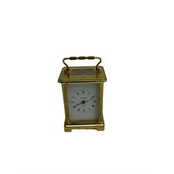 20th century French cornice “Bayard” 8-day timepiece carriage clock, with a lever platform escapement, enamel dial with roman numerals and minute track and Haller Torsion clock with acrylic dome
