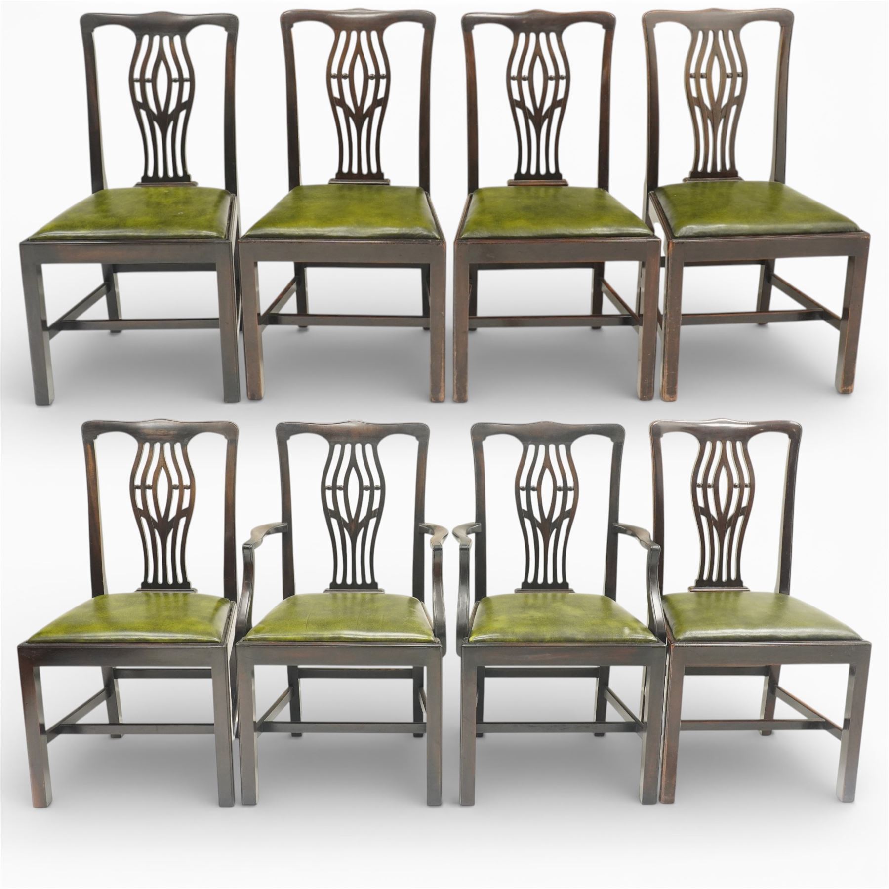 Set of eight Georgian style mahogany dining chairs, comprising six chairs and two carvers, the shaped top rails above pierced vase splats, and green leather upholstered drop in seats, upon square legs united by stretchers