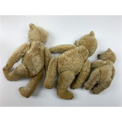 Three 1950s German teddy bears including blonde mohair, possibly Steiff, with swivel jointed head, glass eyes, vertically stitched nose and mouth and jointed limbs with felt paw pads H13