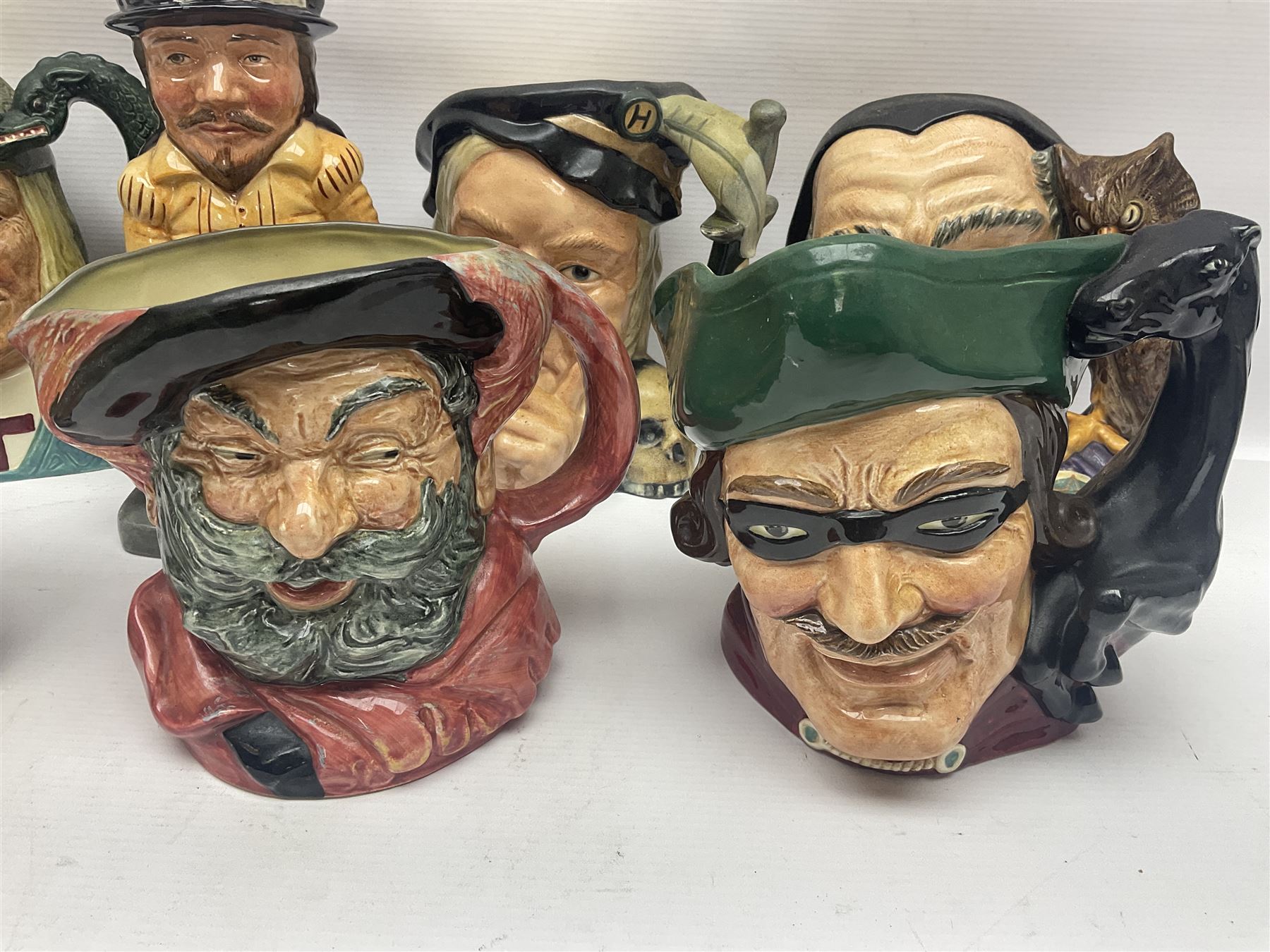 Eight Royal Doulton character jugs, including St George D6618, Guardsman D6568, The Juggler D6835 etc, together with Royal Doulton toby jug Sir Francis Drake D6660