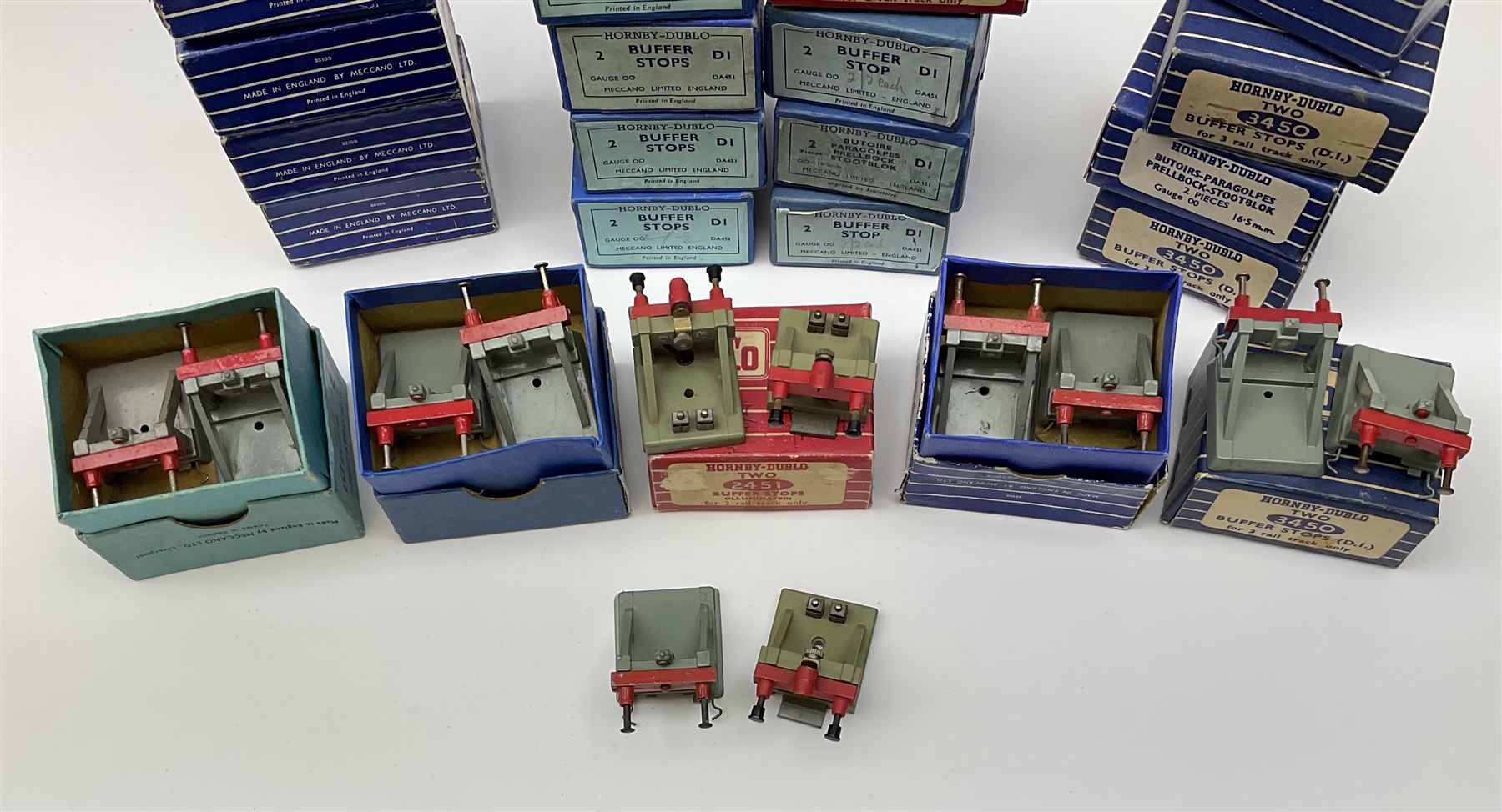 Hornby Dublo - twenty-three pairs of buffer stops including three pairs of 2451 Illuminated for two-rail track; five pairs of 3450 for three-rail track only; and fifteen D1 pairs; all boxed; and two odd loose buffers (21)