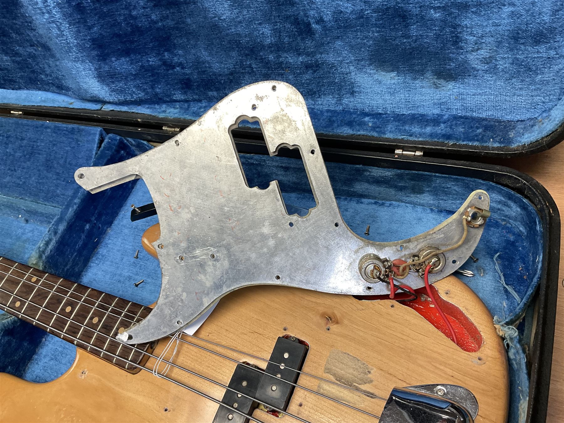 1962 Fender Precision bass guitar; re-finished in natural alder in the 1970s; impressed date code 5NOV62C to end of neck and serial no.90537 to back plate; L115.5cm; in replacement hard carrying case