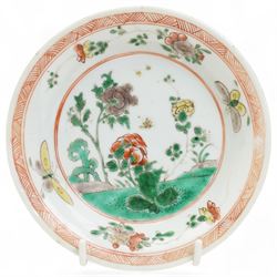 Three Chinese famille verte examples, approximately Yongzheng period, to include two teabowls and two saucers, each decorated with flowers and butterflies, two with sacred fungus mark within double rings, the teabowl with lotus mark, the other indistinct - possibly a Wan mark within lozenge (4)