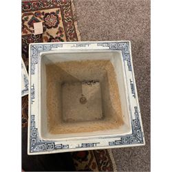 19th century Chinese blue and white planter and stand, each of square slightly tapering and flared form, the planter decorated with figures and precious objects between stylised foliate borders, the stand decorated with landscapes beneath a lipped rim with cell band, planter H28cm D25.5cm, stand H7cm D26cm