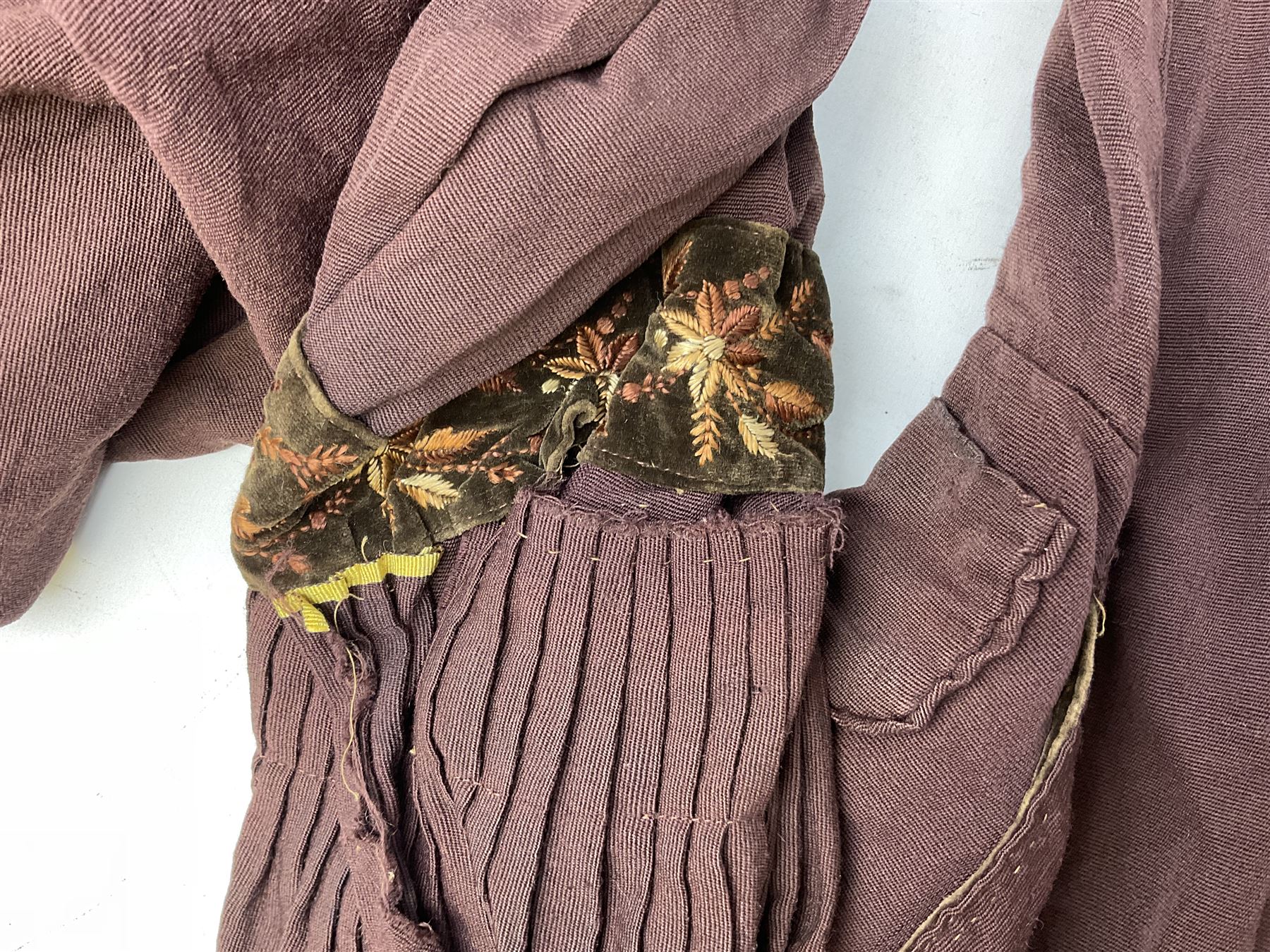Victorian ladies riding habit, the two-piece construction in brown with embroidered floral velvet edging