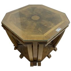1930s Art Deco period walnut nest of tables, square canted top with segmental figured veneers forming flowerhead with birdseye maple centre, with four smaller nesting tables on arched supports united by undertier, on block feet