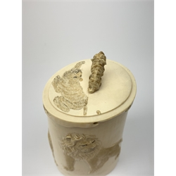Indian ivory tusk box, second quarter of 20th century, of tapering form carved in relief with lions and tiger, the lift-off lid with seated tiger knop H14cm